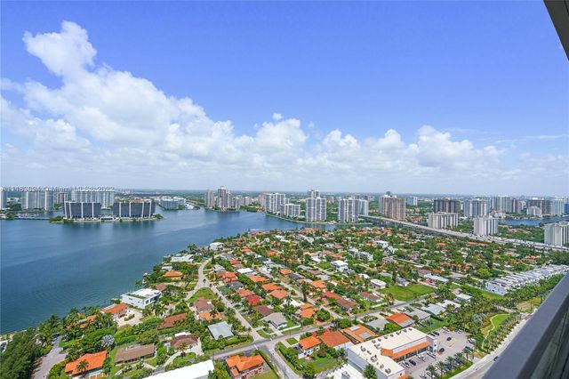 a view of a lake with a city
