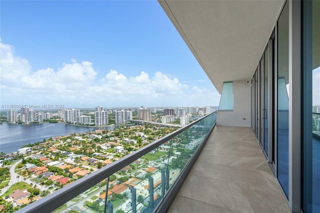 a view of balcony with city and lake