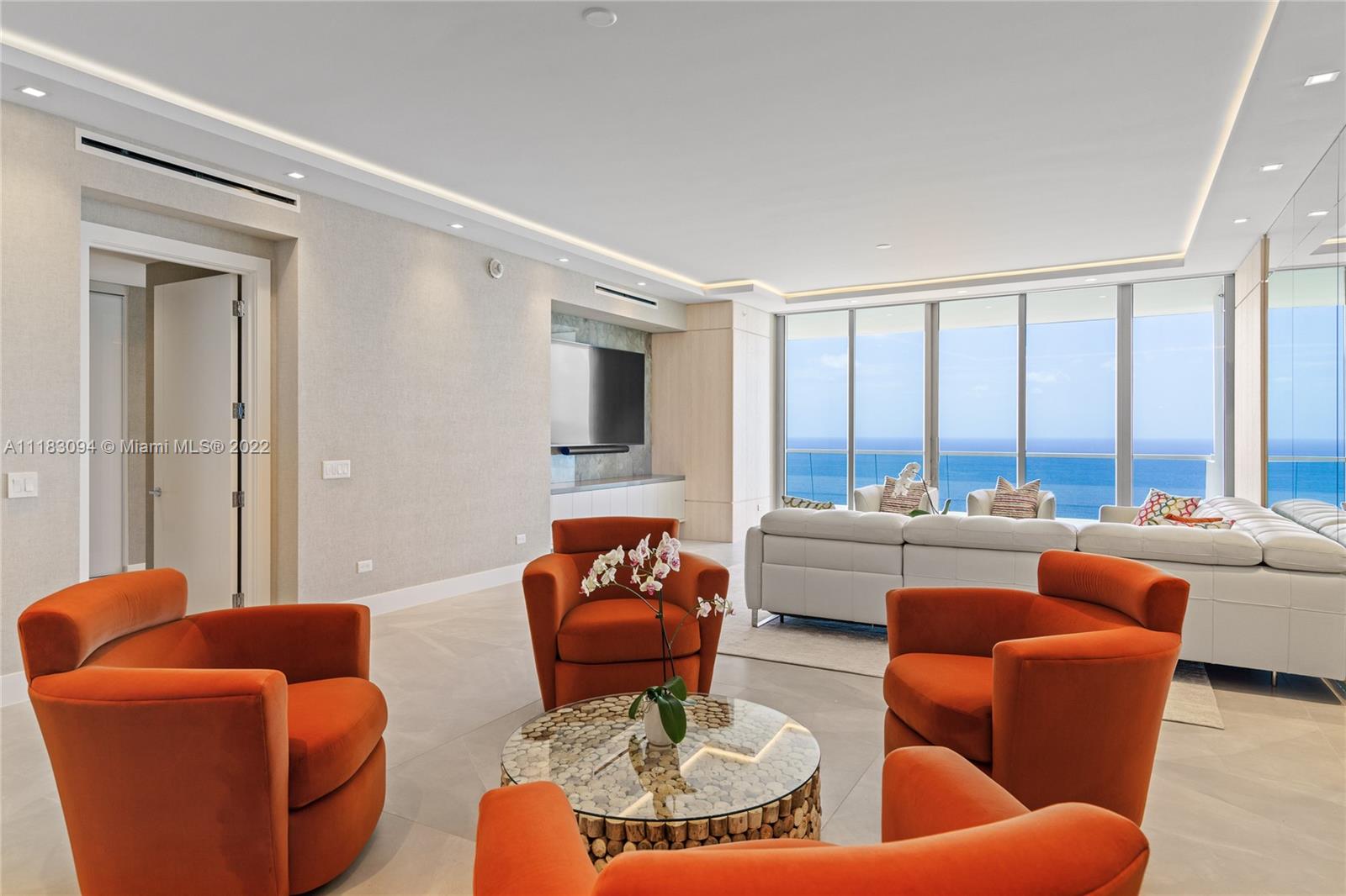18501 Collins Avenue, Unit 3302 Sunny Isles Beach, FL 33160 - Photo 9 of 48 a living room with furniture and a large window