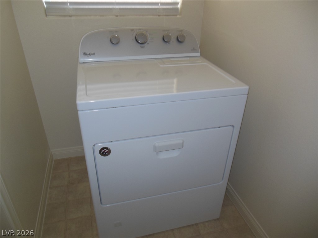 6390 Jackson Spring Road Las Vegas, NV 89118 - Photo 22 of 27 A well-maintained laundry nook with a functional washer and dryer, ready for immediate use.