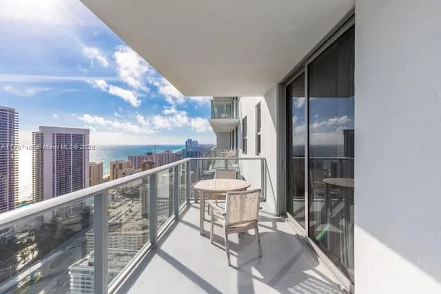 a view of a chairs and table in backyard