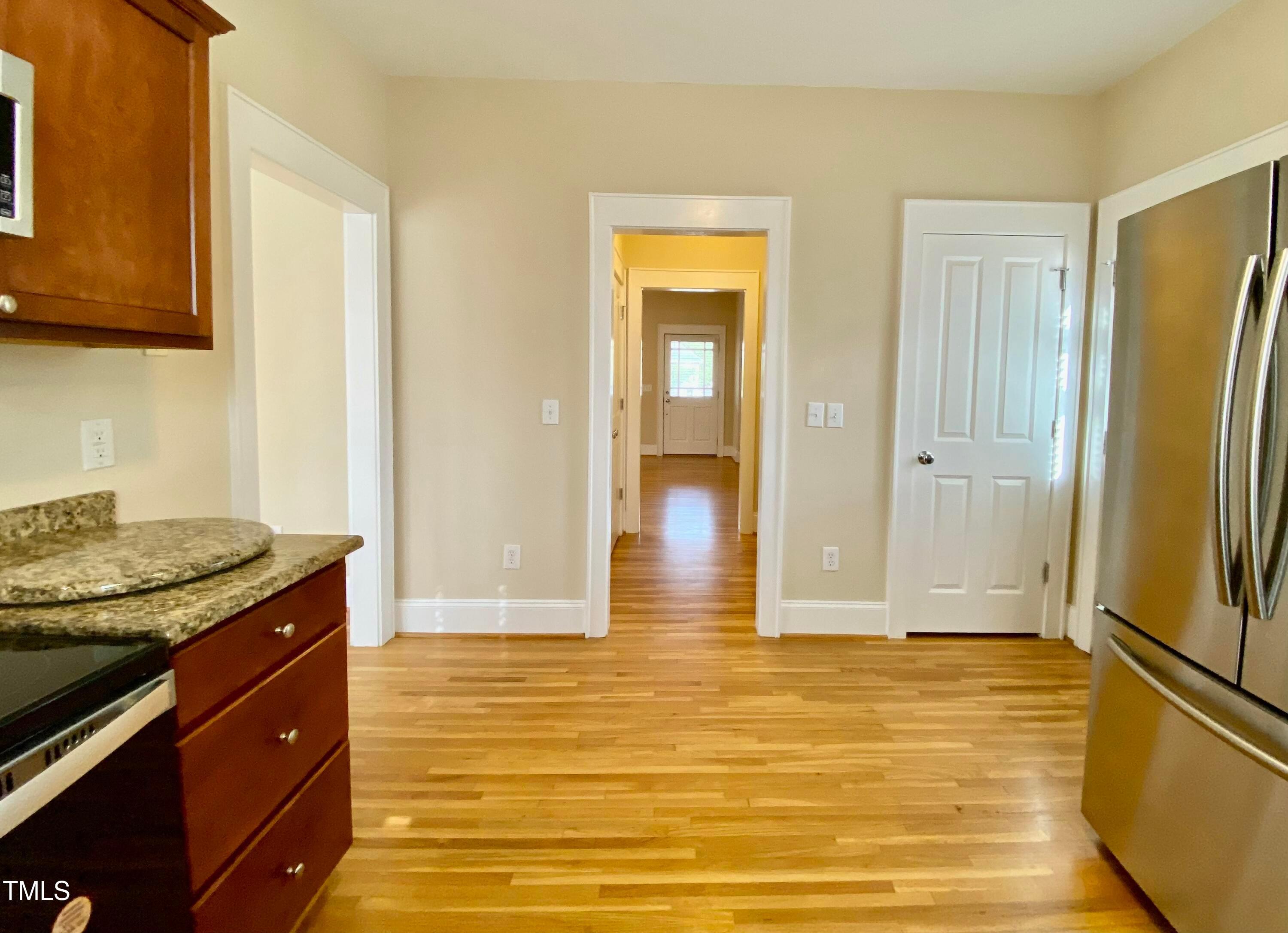 813 Clarendon Street Durham, NC 27705 - Photo 16 of 36 a view of room with window and wooden floor