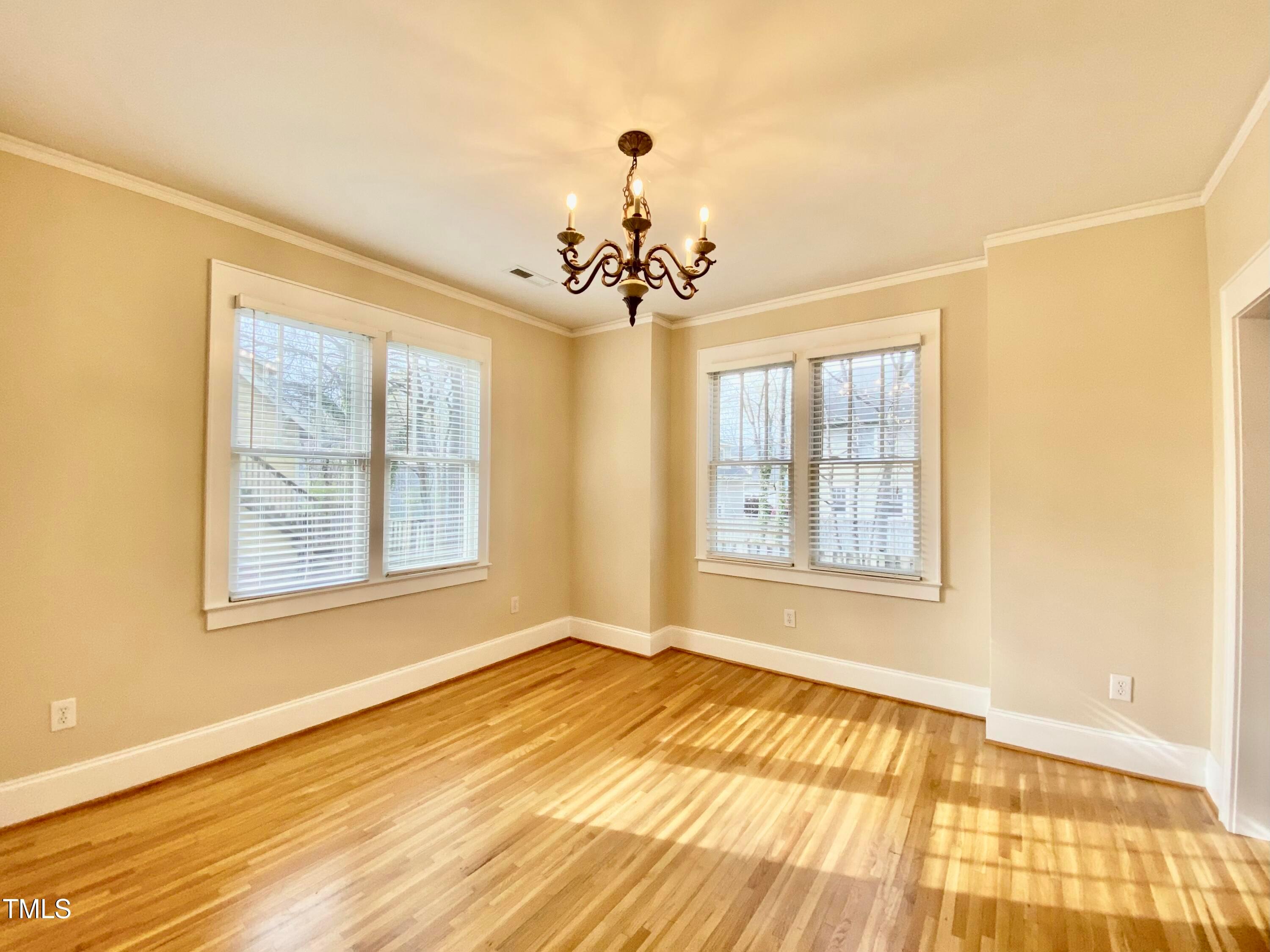 813 Clarendon Street Durham, NC 27705 - Photo 17 of 36 a view of an empty room with a window