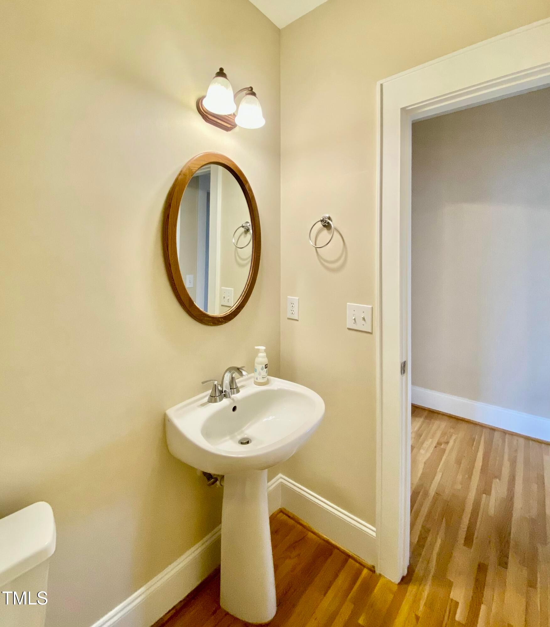 813 Clarendon Street Durham, NC 27705 - Photo 20 of 36 a bathroom with a sink and a mirror