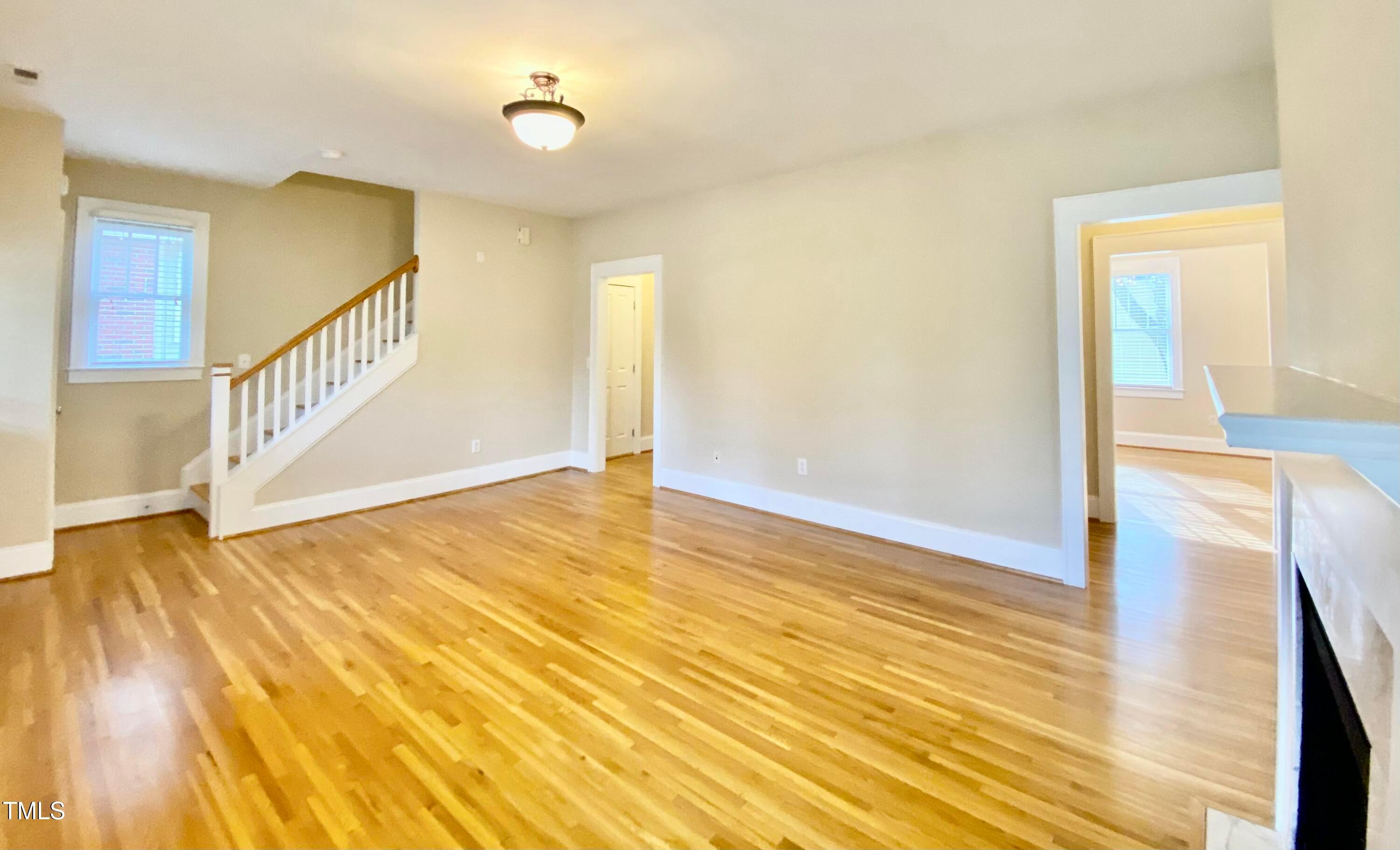 813 Clarendon Street Durham, NC 27705 - Photo 22 of 36 a view of an empty room with wooden floor