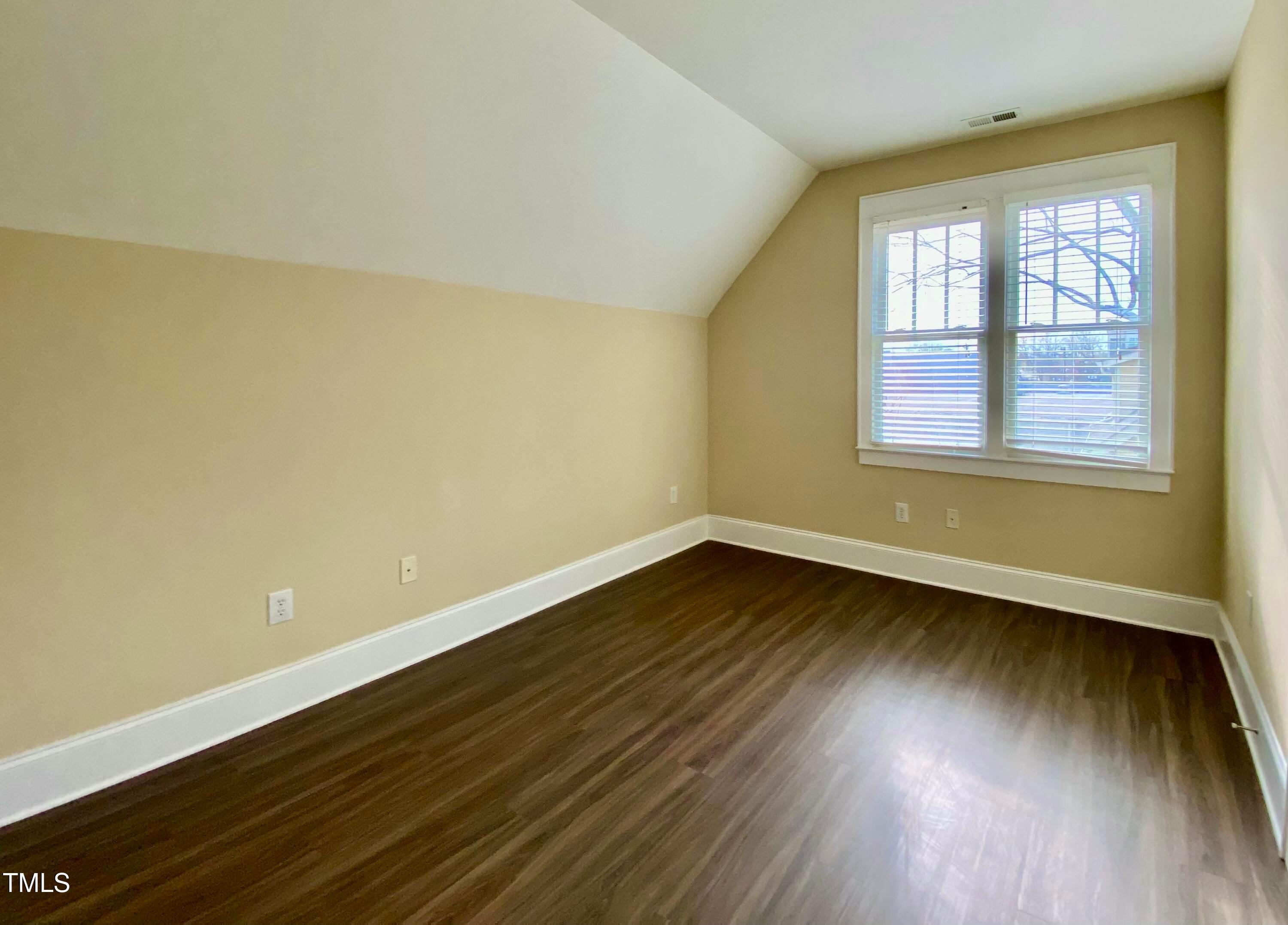 813 Clarendon Street Durham, NC 27705 - Photo 24 of 36 an empty room with wooden floor and windows