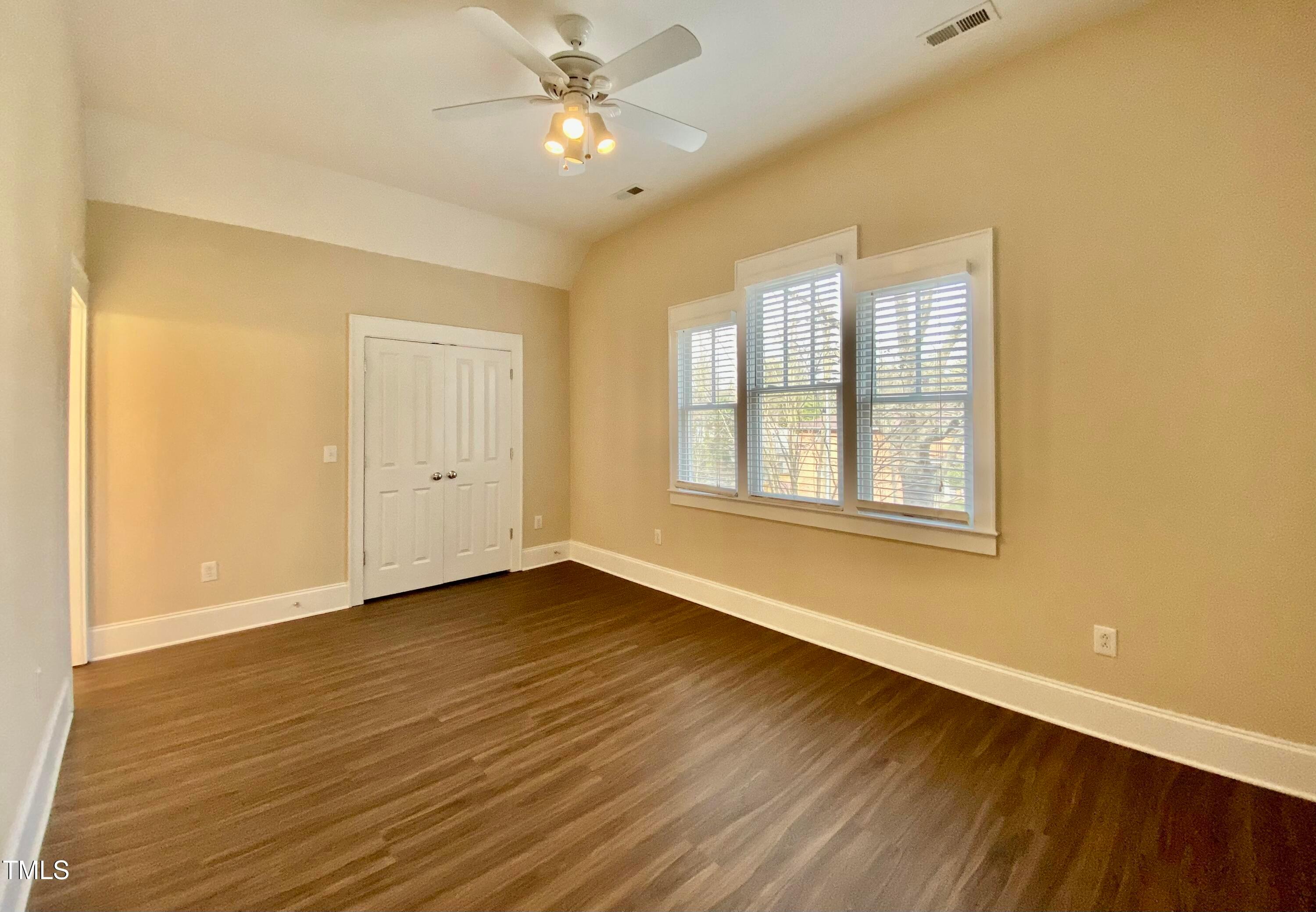 813 Clarendon Street Durham, NC 27705 - Photo 31 of 36 a view of an empty room with wooden floor and a window