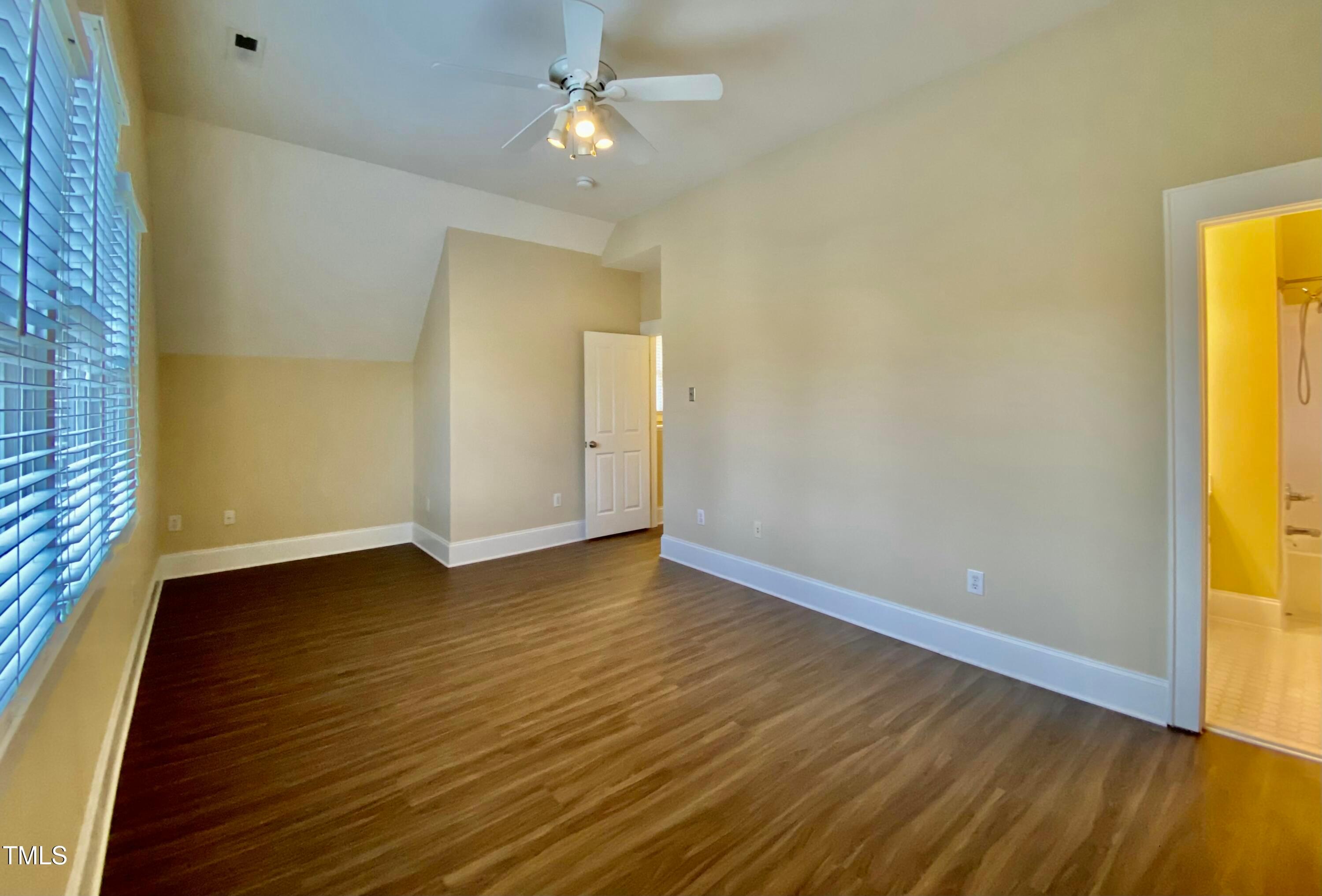 813 Clarendon Street Durham, NC 27705 - Photo 32 of 36 an empty room with wooden floor and entrance