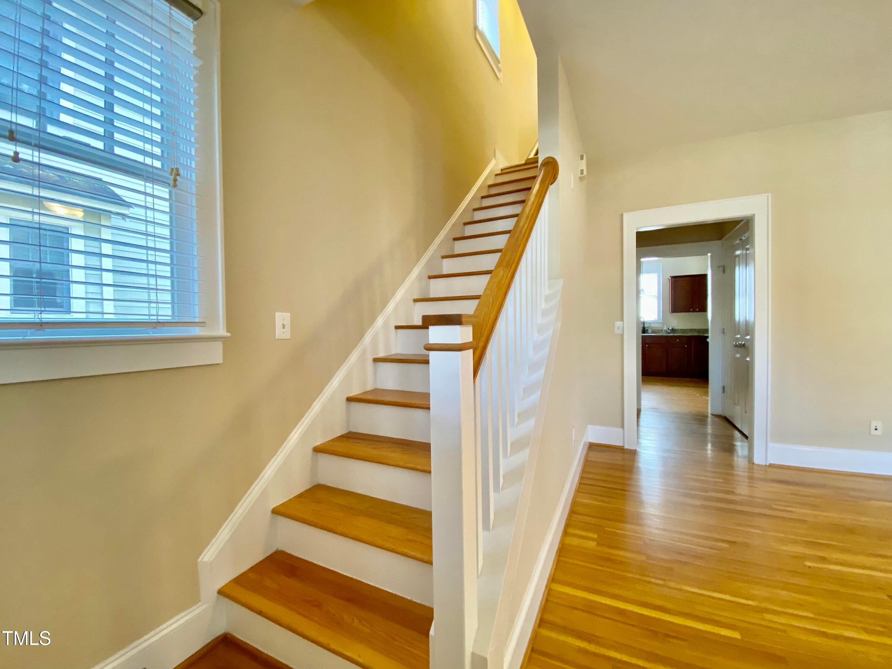 813 Clarendon Street Durham, NC 27705 - Photo 6 of 36 a view of stairs and wooden floor