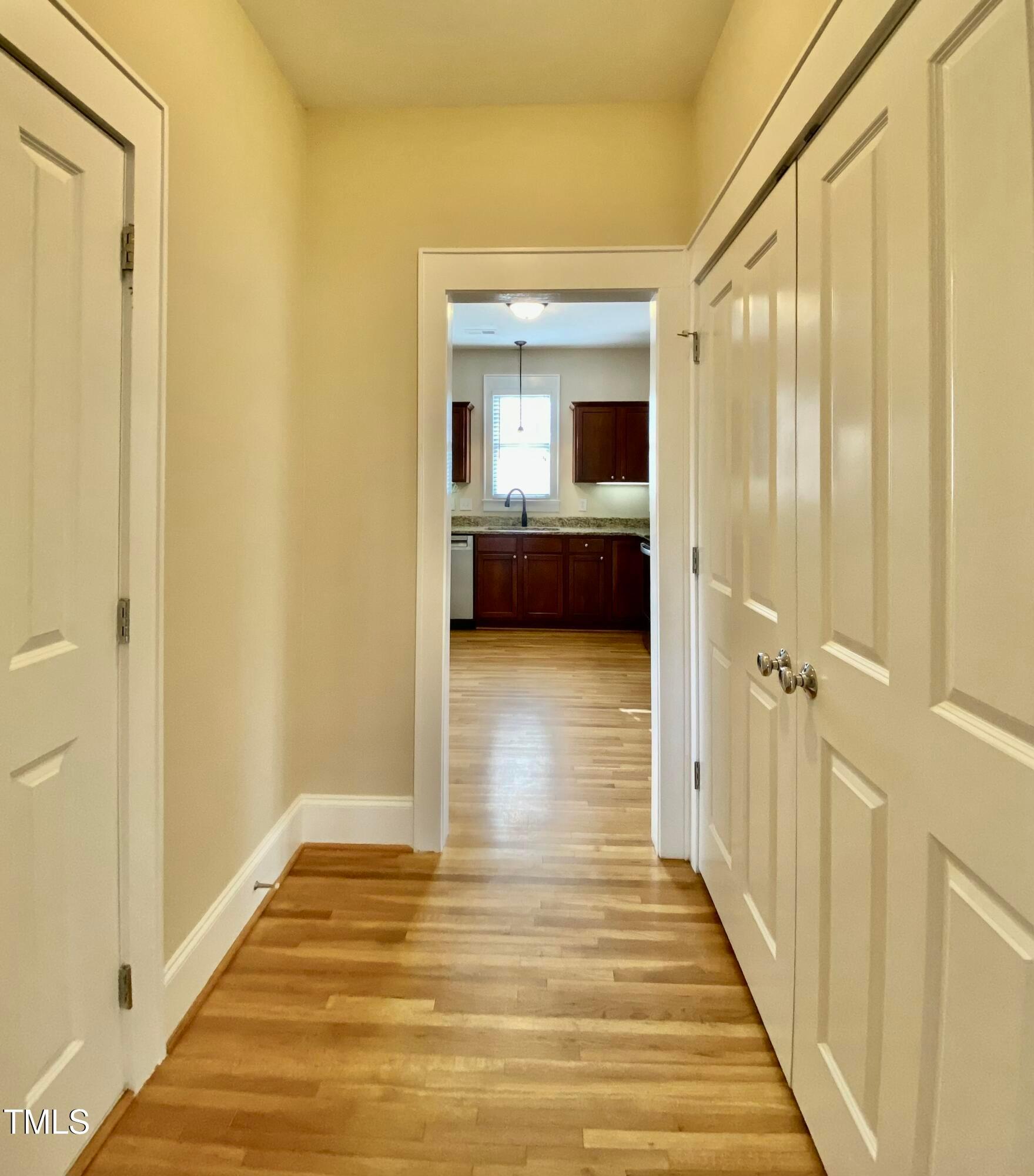 813 Clarendon Street Durham, NC 27705 - Photo 9 of 36 a view of a hallway with wooden floor and closet