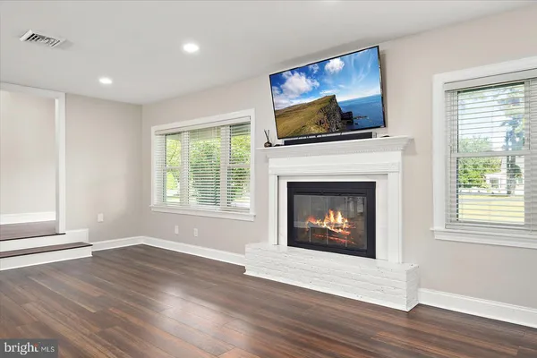 a large kitchen with stainless steel appliances granite countertop a stove and a sink