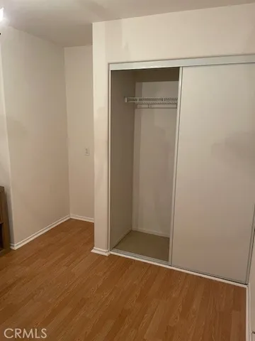 an empty room with wooden floor