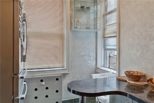 a bathroom with a sink a mirror and a window