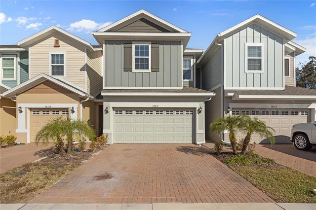 a front view of a house with yard