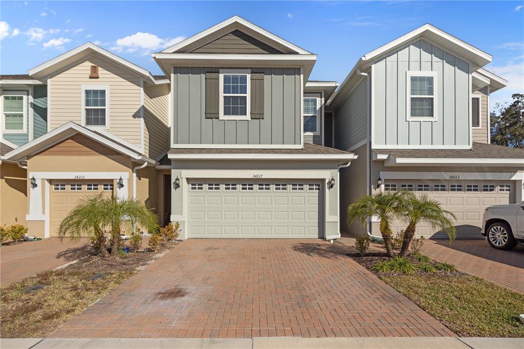 a front view of a house with yard