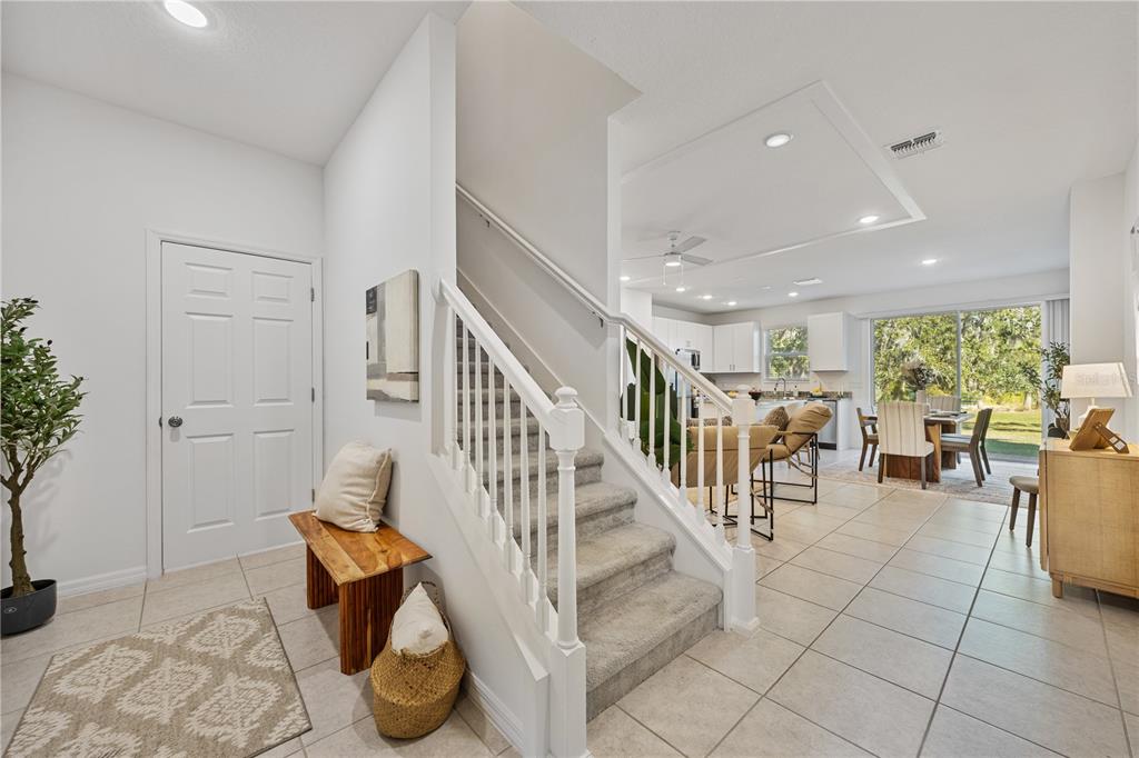 34217 Cinder Way Wesley Chapel, FL 33545 - Photo 14 of 27 a view of entryway and hall with wooden floor