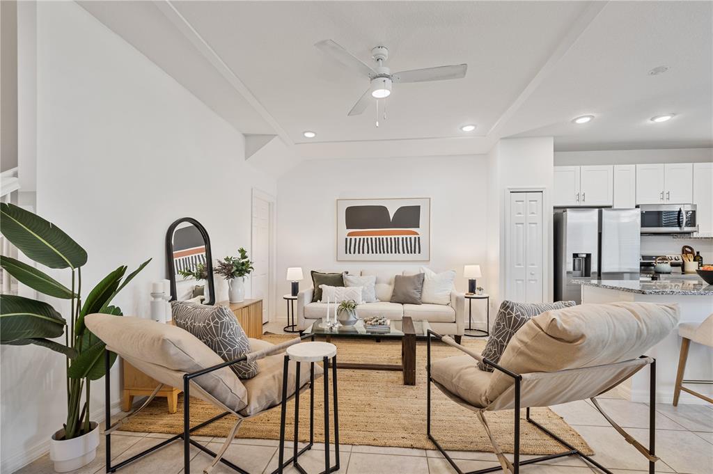 34217 Cinder Way Wesley Chapel, FL 33545 - Photo 3 of 27 a living room with furniture a table and chairs