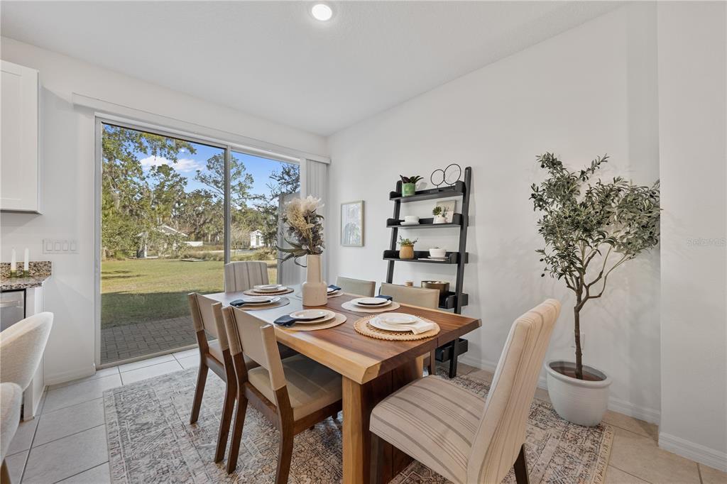34217 Cinder Way Wesley Chapel, FL 33545 - Photo 7 of 27 a view of a dining room with furniture window and outside view