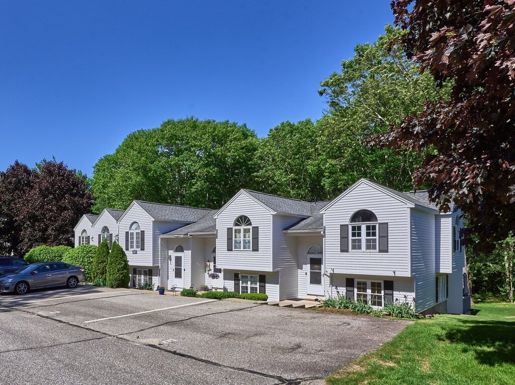 97 Riverview Place, Unit C Southbridge, MA 01550 - Photo 2 of 35 a front view of a house with a yard