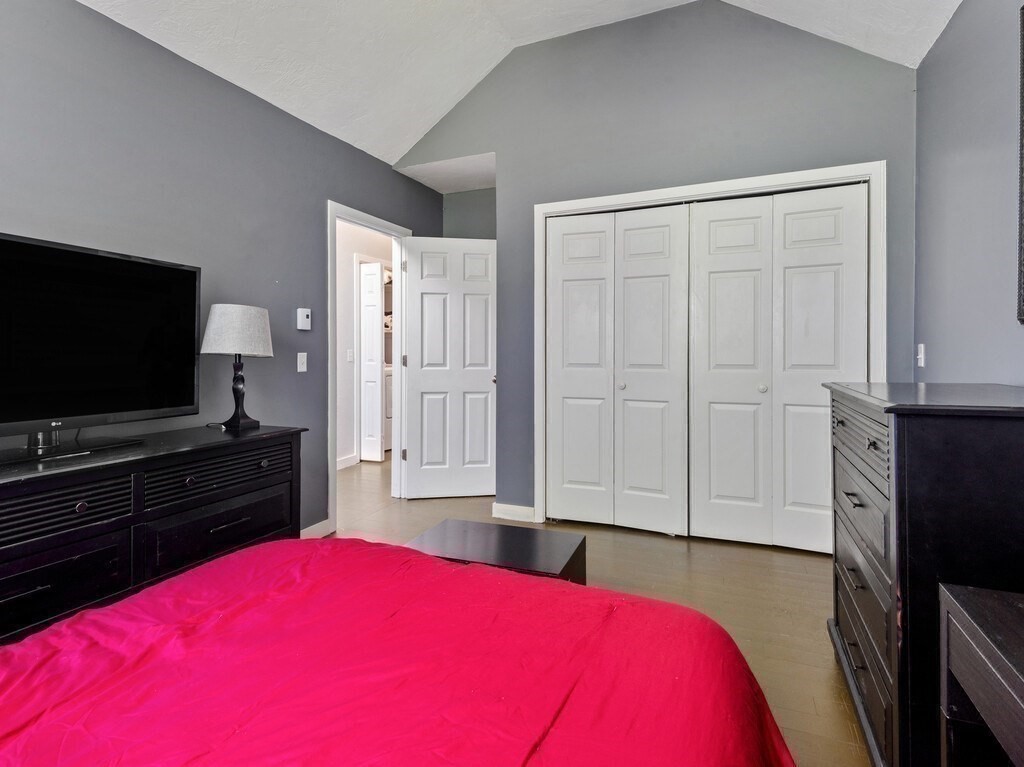 97 Riverview Place, Unit C Southbridge, MA 01550 - Photo 24 of 35 a bedroom with a bed and a flat screen tv