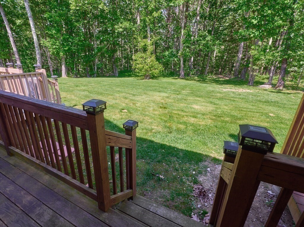 97 Riverview Place, Unit C Southbridge, MA 01550 - Photo 29 of 35 a view of a deck with a yard and furniture