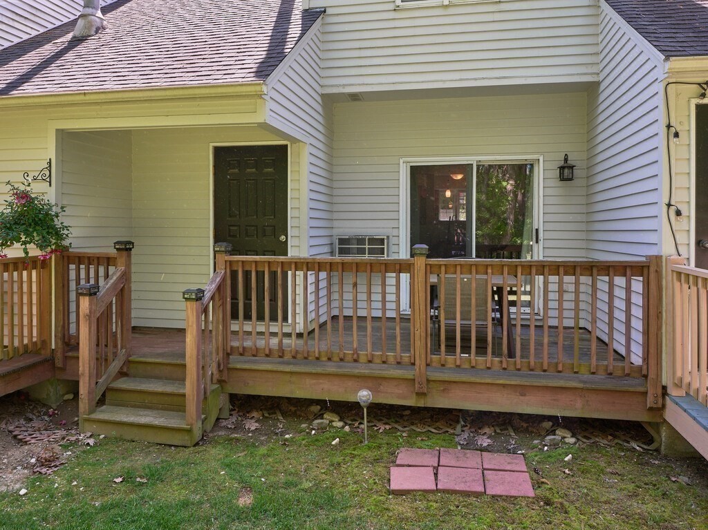 97 Riverview Place, Unit C Southbridge, MA 01550 - Photo 30 of 35 a view of a deck with a small yard