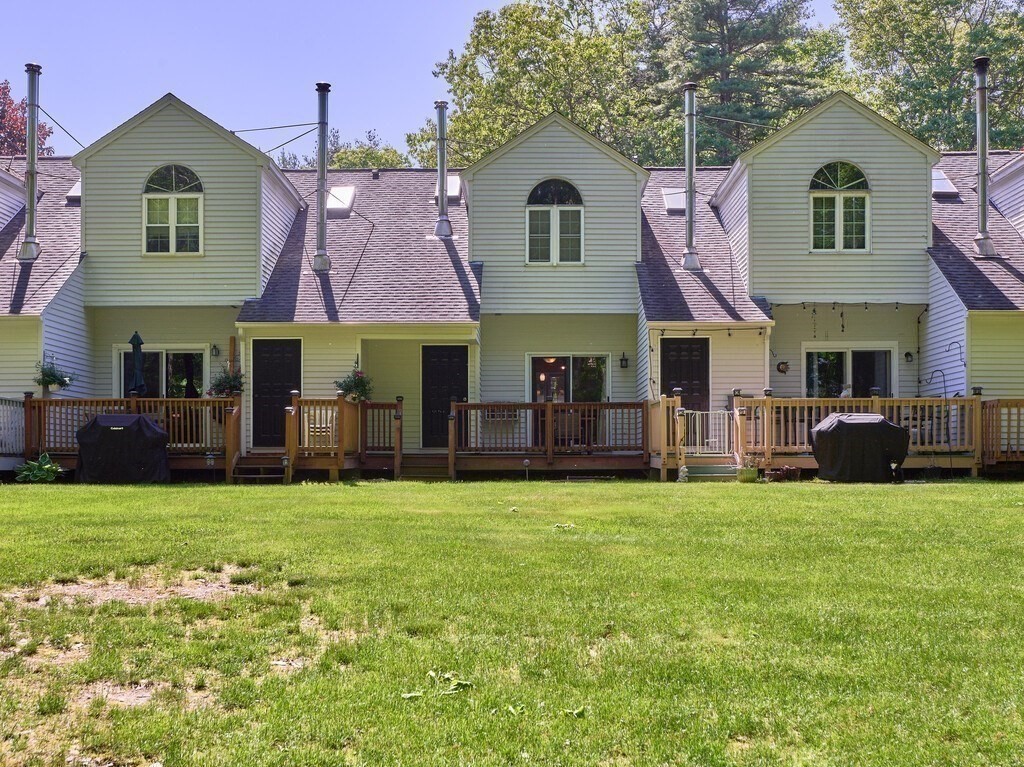 97 Riverview Place, Unit C Southbridge, MA 01550 - Photo 31 of 35 a view of a house with a yard