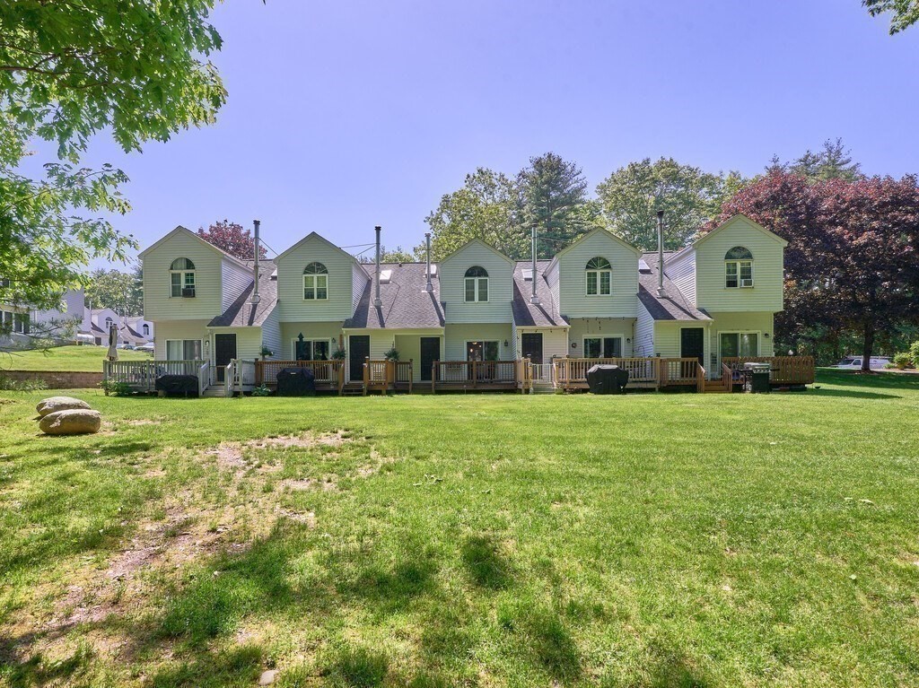 97 Riverview Place, Unit C Southbridge, MA 01550 - Photo 32 of 35 a front view of house with yard and outdoor seating