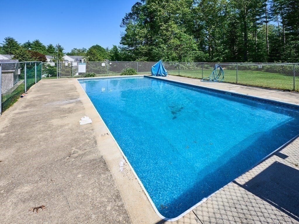 97 Riverview Place, Unit C Southbridge, MA 01550 - Photo 33 of 35 a view of a swimming pool with a yard