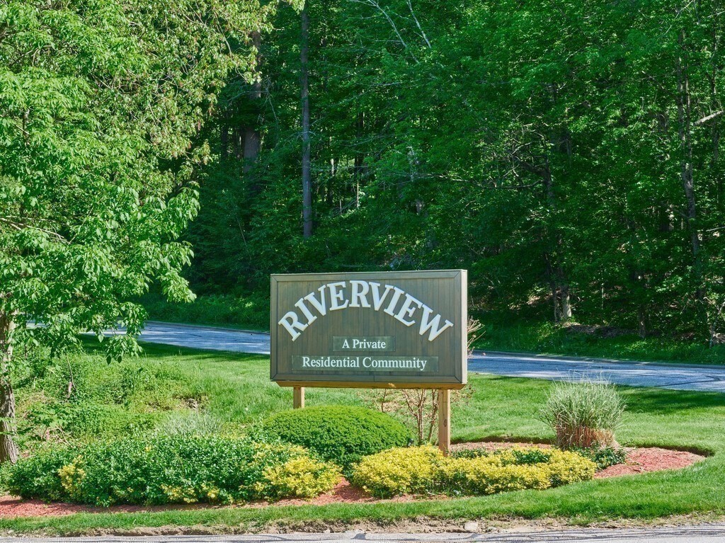 97 Riverview Place, Unit C Southbridge, MA 01550 - Photo 35 of 35 a sign that is sitting on a lush green field