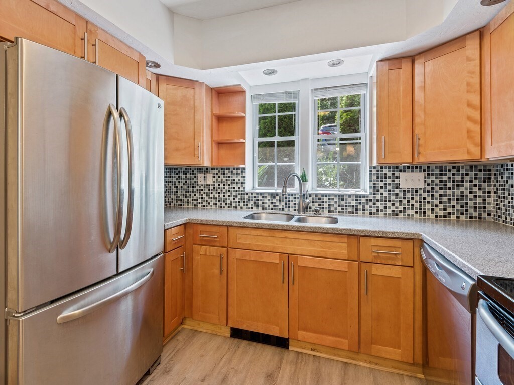 97 Riverview Place, Unit C Southbridge, MA 01550 - Photo 4 of 35 a white refrigerator freezer sitting inside of a kitchen