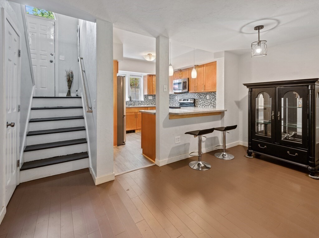97 Riverview Place, Unit C Southbridge, MA 01550 - Photo 10 of 35 a view of a livingroom with furniture and staircase