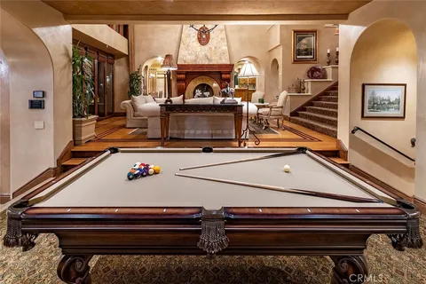 a view of living room with granite countertop furniture and fireplace