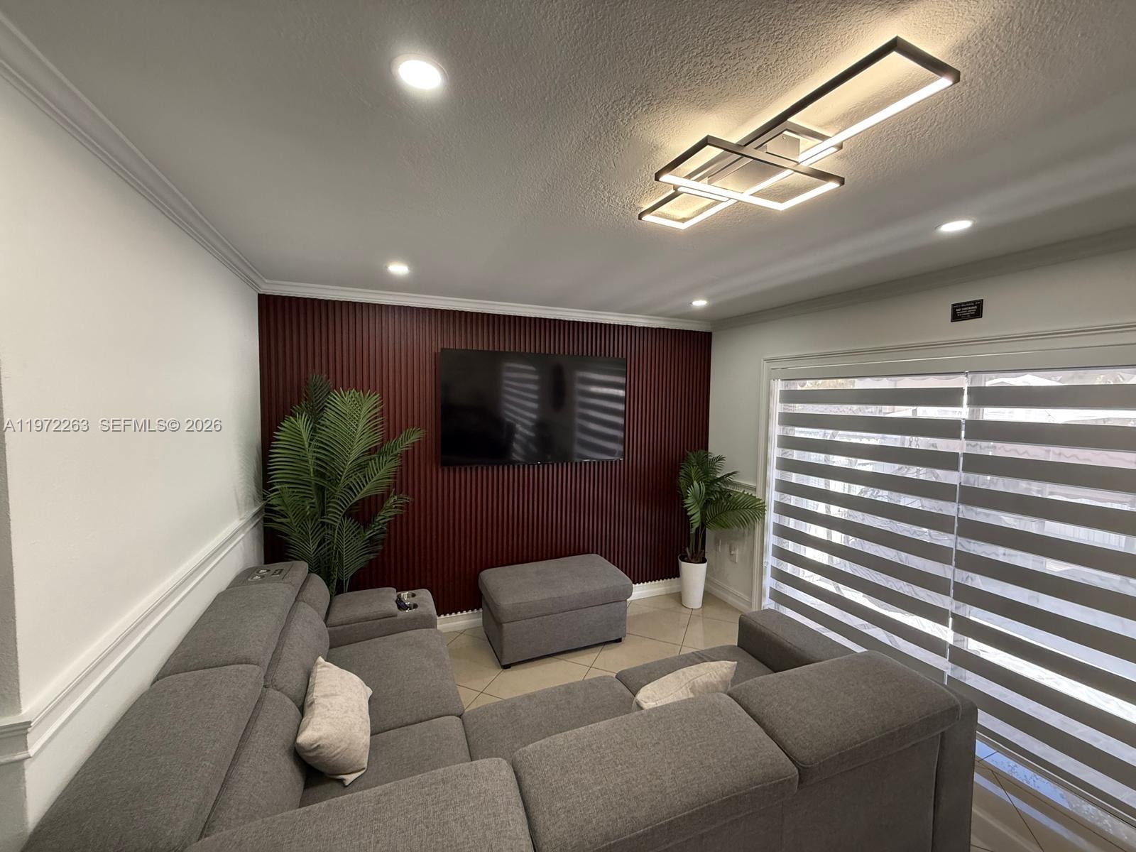 15445 Southwest 57th Street Miami, FL 33193 - Photo 15 of 78 a lobby with furniture and a potted plant