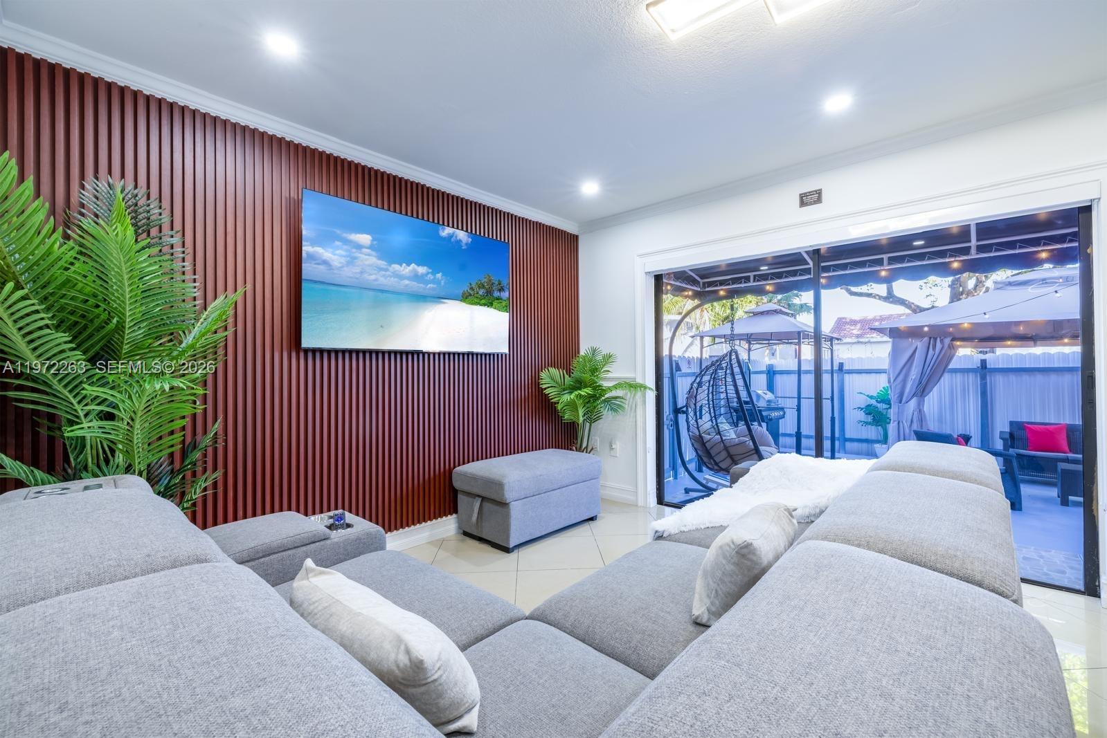 15445 Southwest 57th Street Miami, FL 33193 - Photo 17 of 78 a living room with furniture and a potted plant
