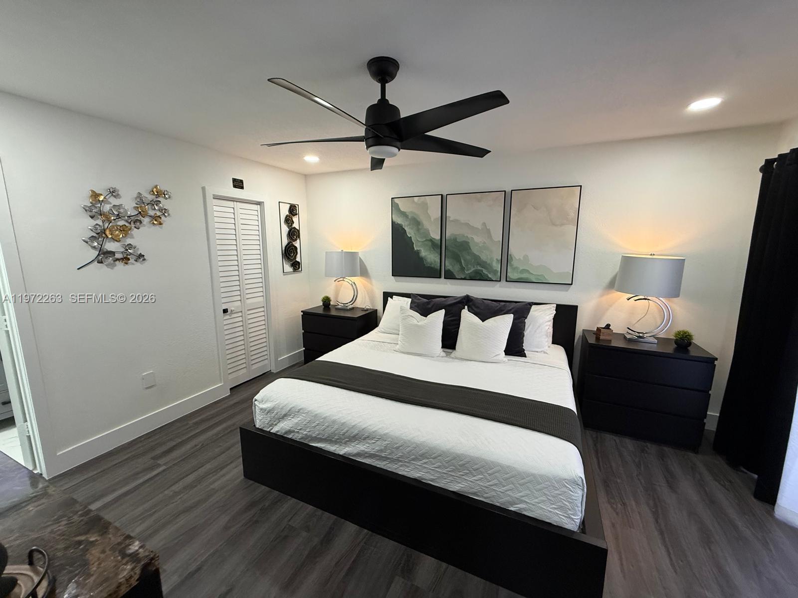 15445 Southwest 57th Street Miami, FL 33193 - Photo 33 of 78 a bed room with a bed and a window