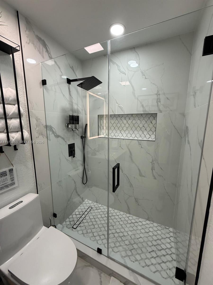 15445 Southwest 57th Street Miami, FL 33193 - Photo 34 of 78 a bathroom with a shower