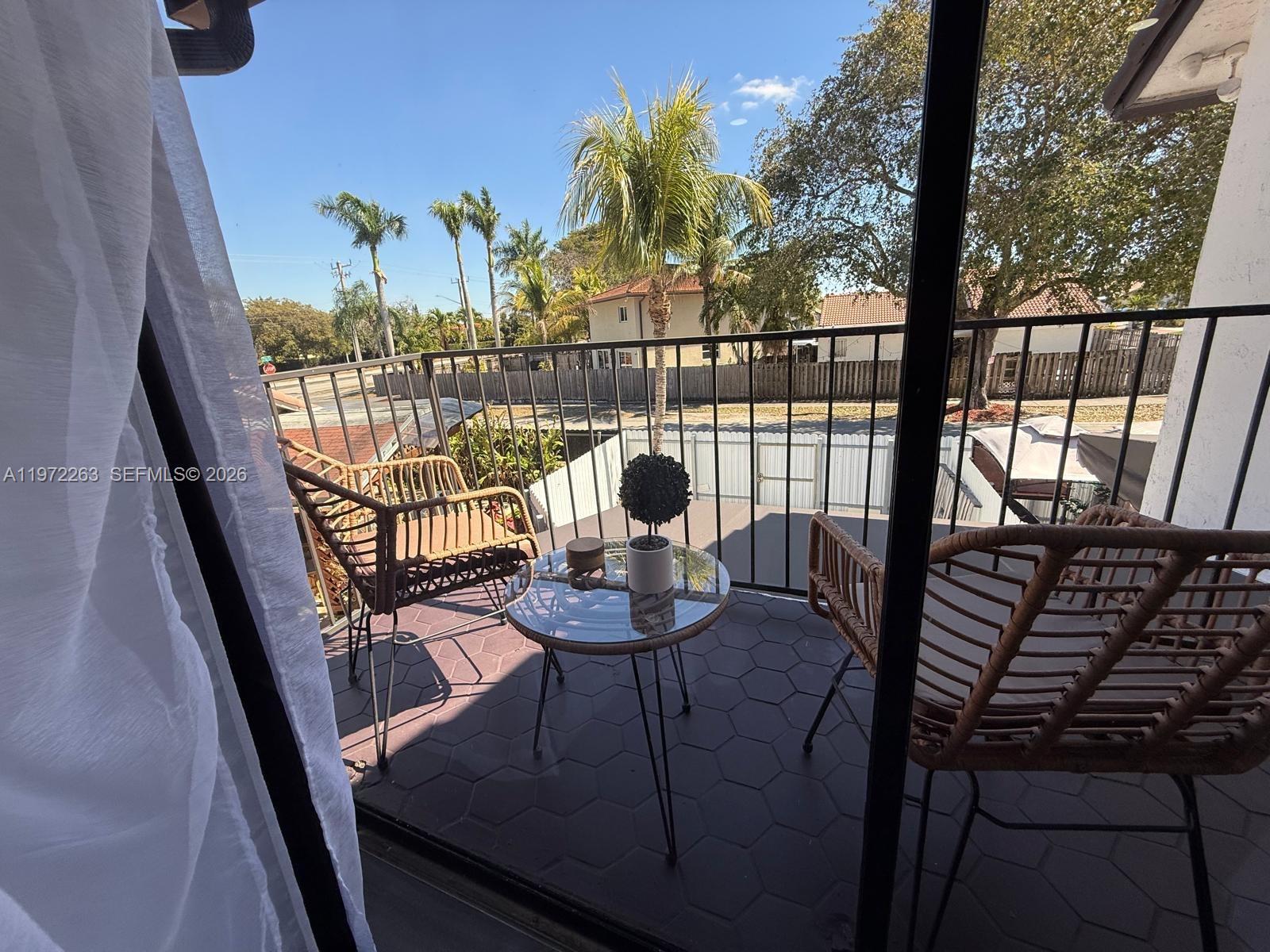 15445 Southwest 57th Street Miami, FL 33193 - Photo 35 of 78 a view of a balcony with chairs