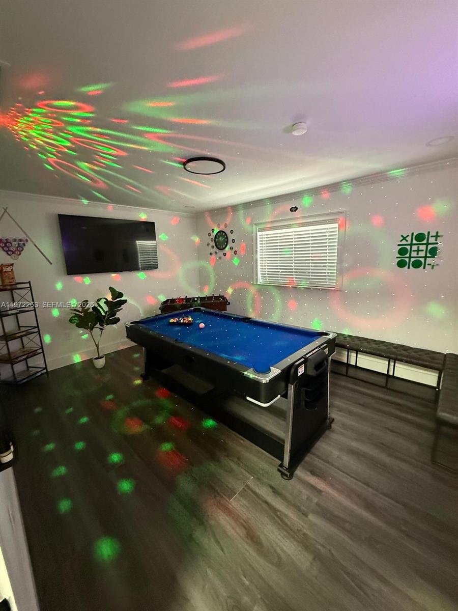 15445 Southwest 57th Street Miami, FL 33193 - Photo 41 of 78 a living room with kitchen furniture and a flat screen tv