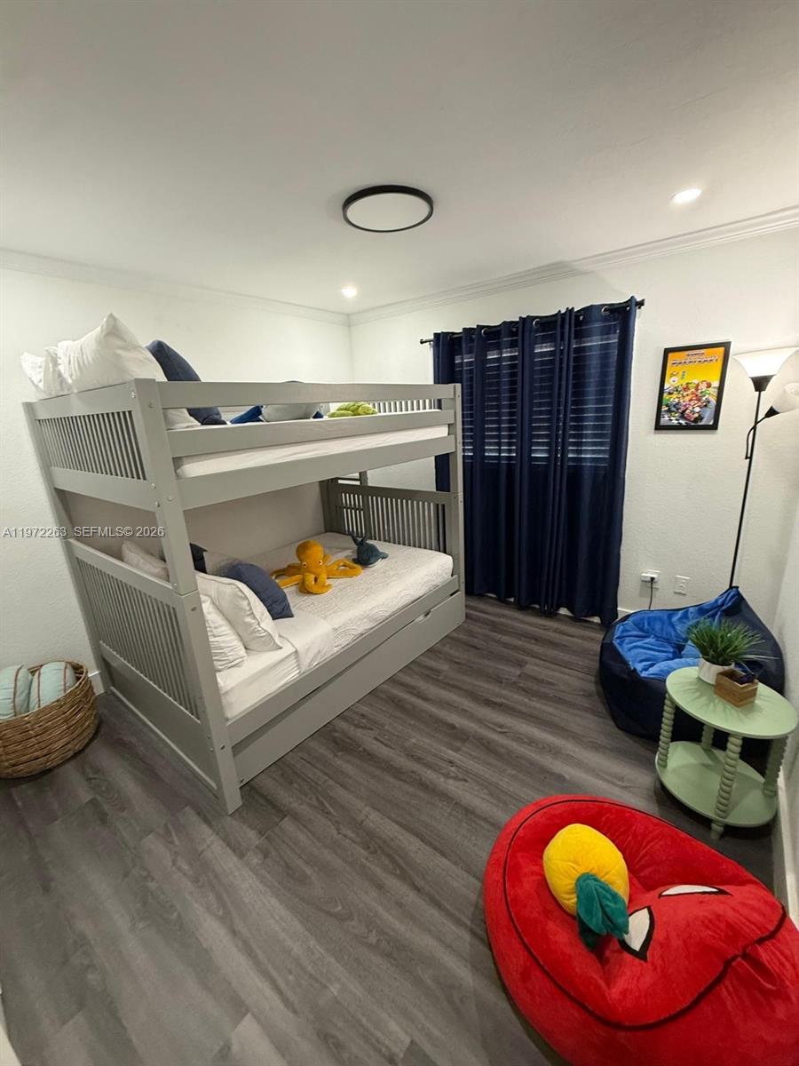 15445 Southwest 57th Street Miami, FL 33193 - Photo 42 of 78 a bedroom with furniture and a wooden floor