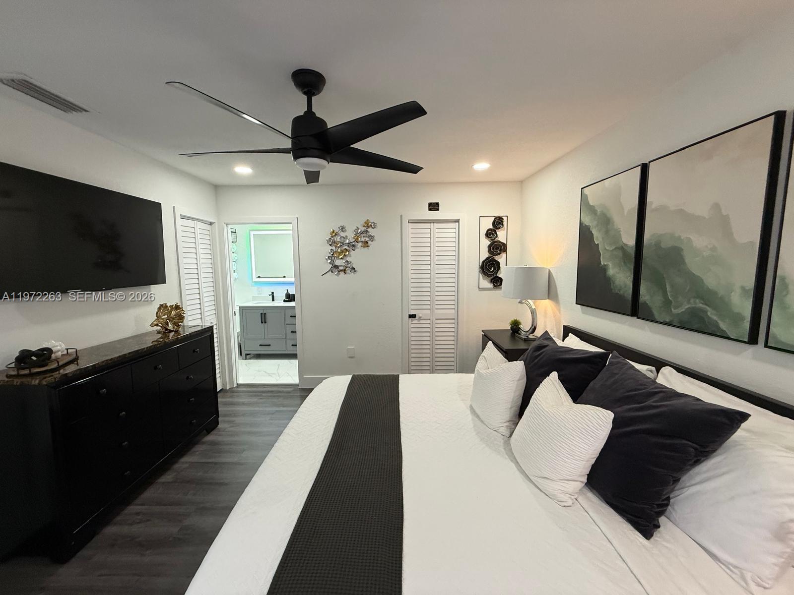 15445 Southwest 57th Street Miami, FL 33193 - Photo 44 of 78 a living room with furniture and a flat screen tv