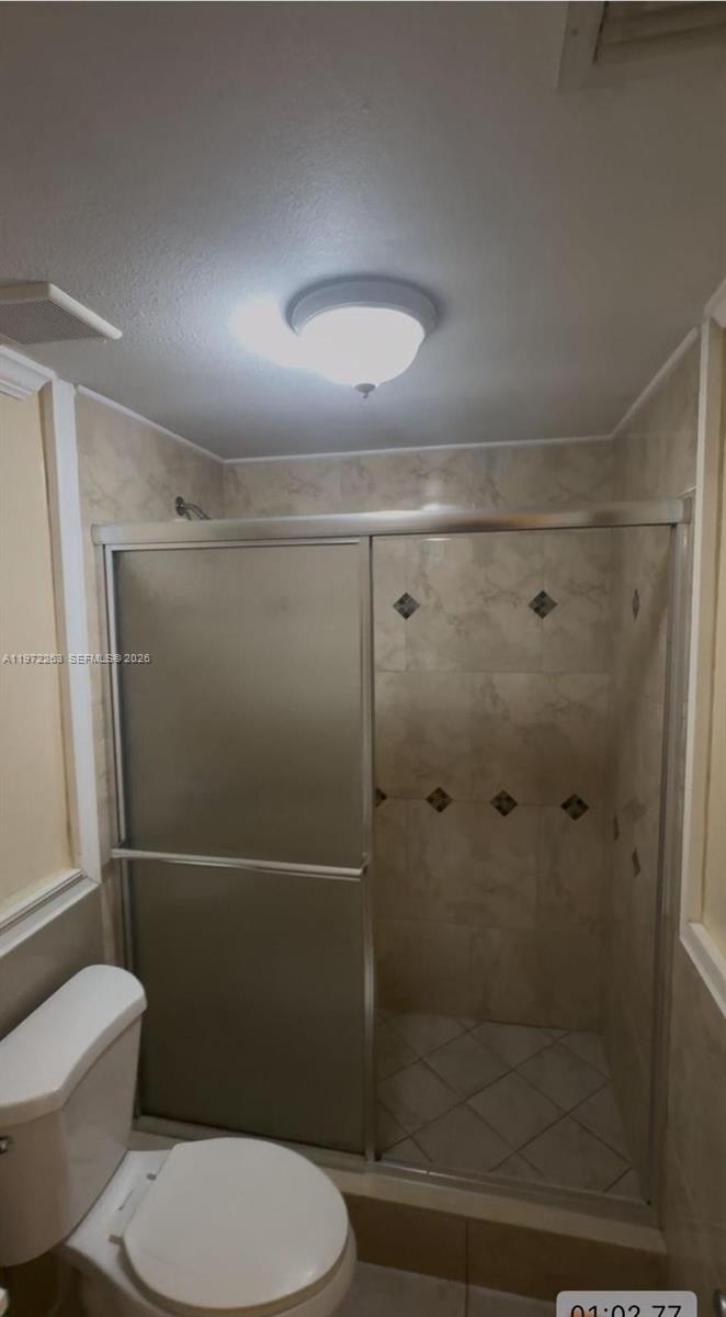 15445 Southwest 57th Street Miami, FL 33193 - Photo 50 of 78 a bathroom with a toilet and a shower
