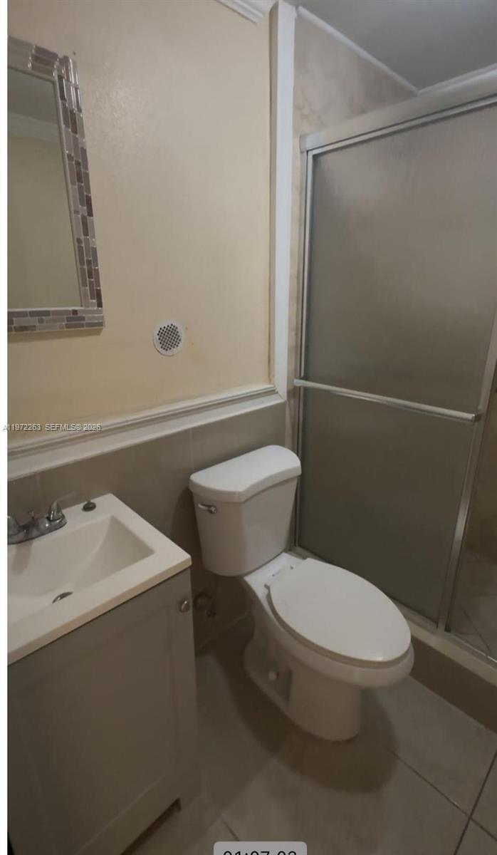 15445 Southwest 57th Street Miami, FL 33193 - Photo 53 of 78 a white toilet sitting next to a bathroom sink