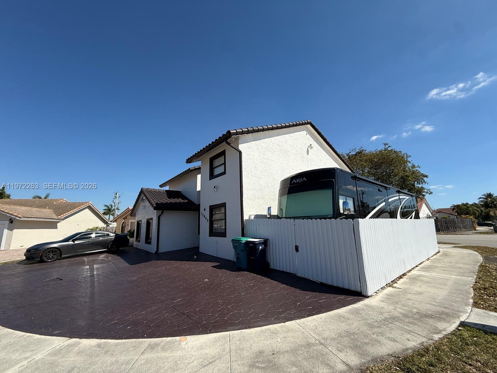 15445 Southwest 57th Street Miami, FL 33193 - Photo 6 of 78 a view of a house with a garage