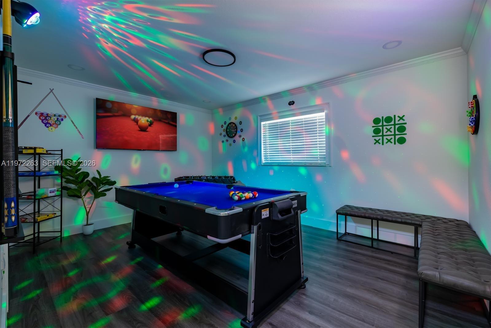 15445 Southwest 57th Street Miami, FL 33193 - Photo 64 of 78 a living room with furniture and a flat screen tv