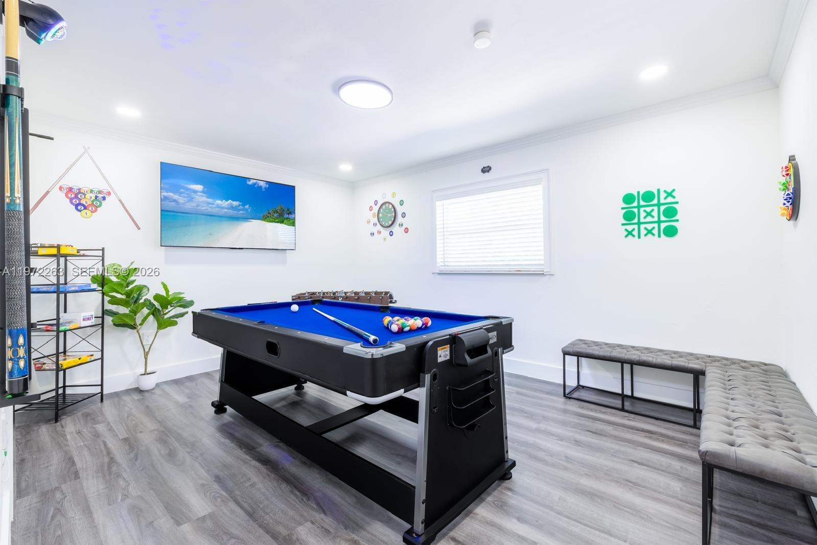 15445 Southwest 57th Street Miami, FL 33193 - Photo 66 of 78 a room with furniture pool table and paintings on the wall