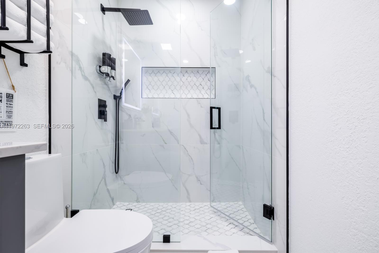 15445 Southwest 57th Street Miami, FL 33193 - Photo 68 of 78 a bathroom with a toilet and a shower