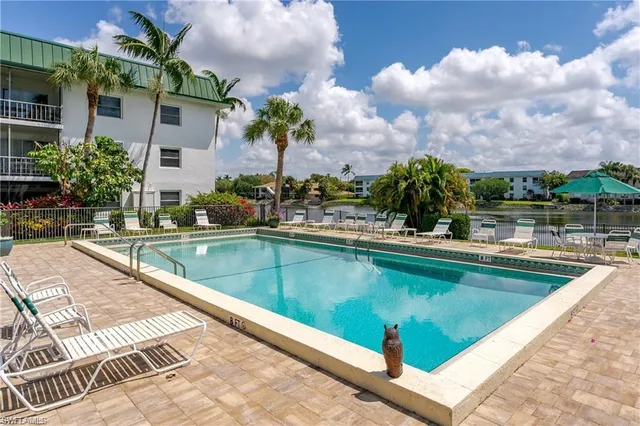 a view of a swimming pool with a patio