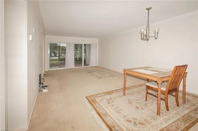 a room with a table and chairs