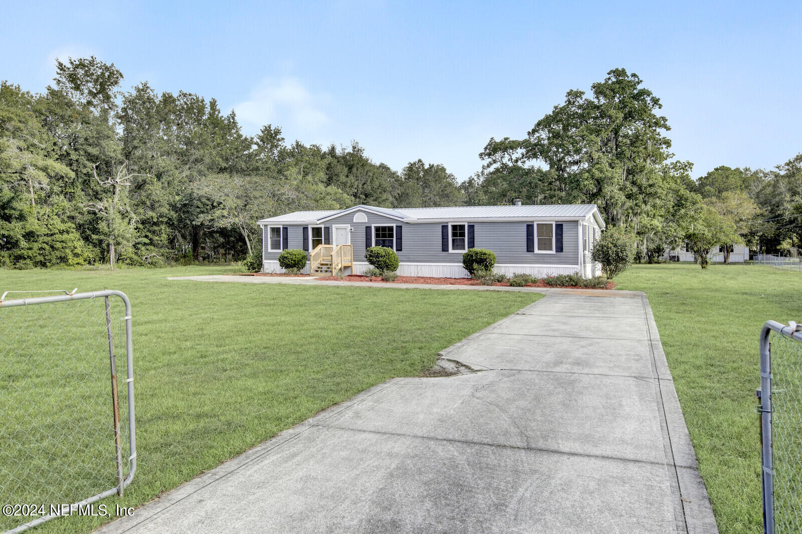 4016 Pinto Road Middleburg, FL 32068 - Photo 2 of 37 a view of a house with a big yard